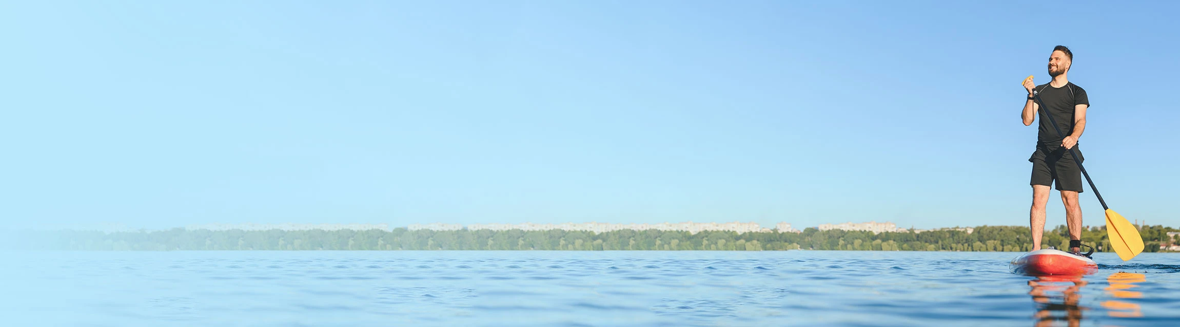 man on a paddlobard